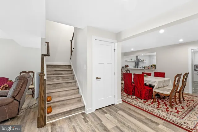 a view of a garden with a house in the background