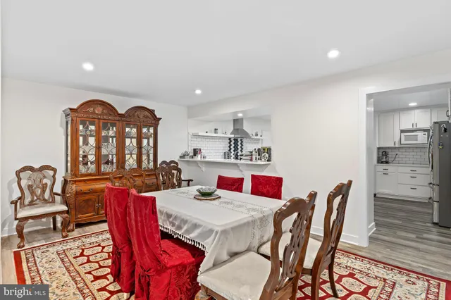 an aerial view of residential houses with outdoor space and street view