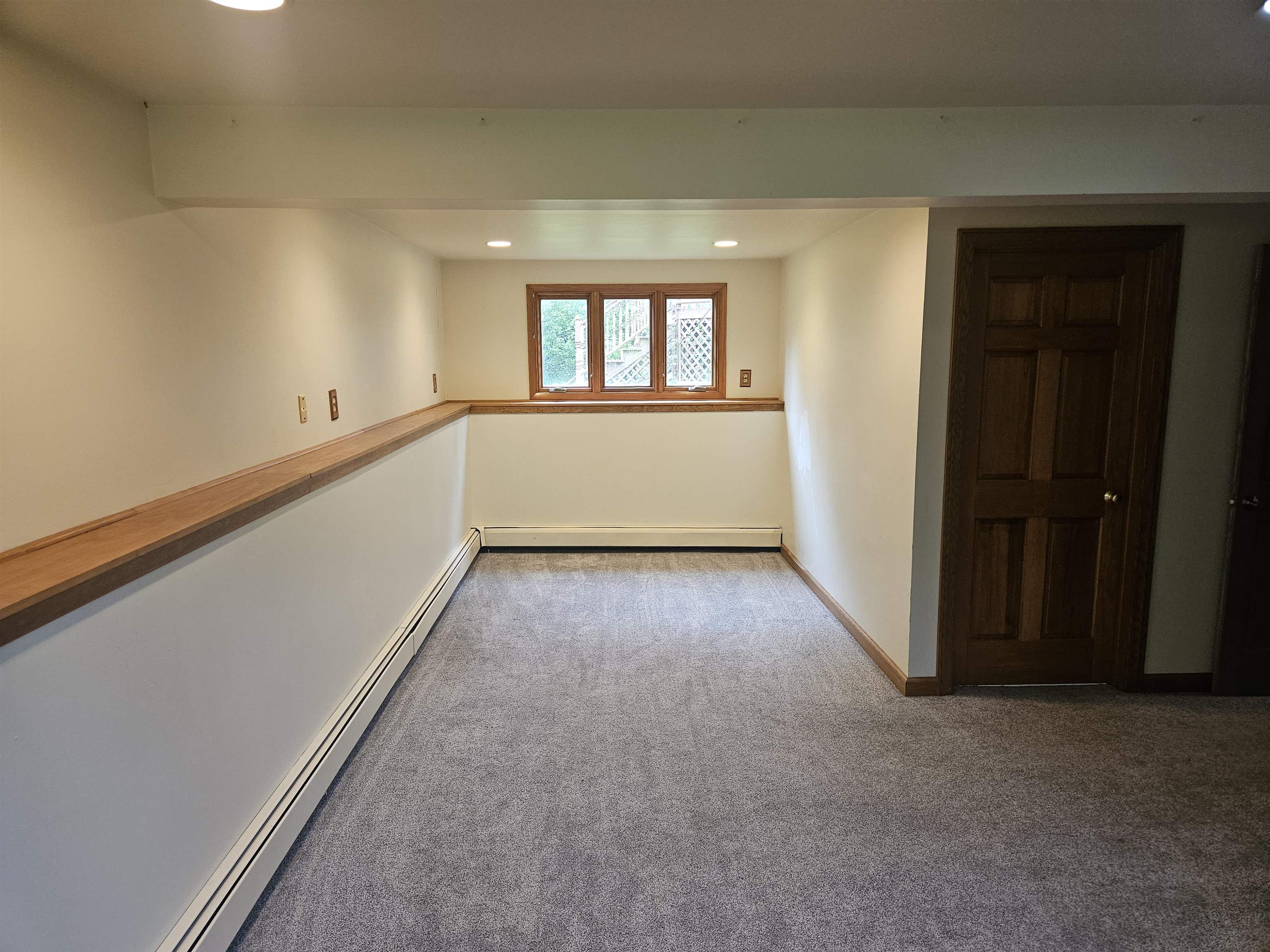 84 Erickson Road Esko, MN 55733 - Photo 3 of 16 Carpeted spare room featuring a baseboard heating unit and recessed lighting
