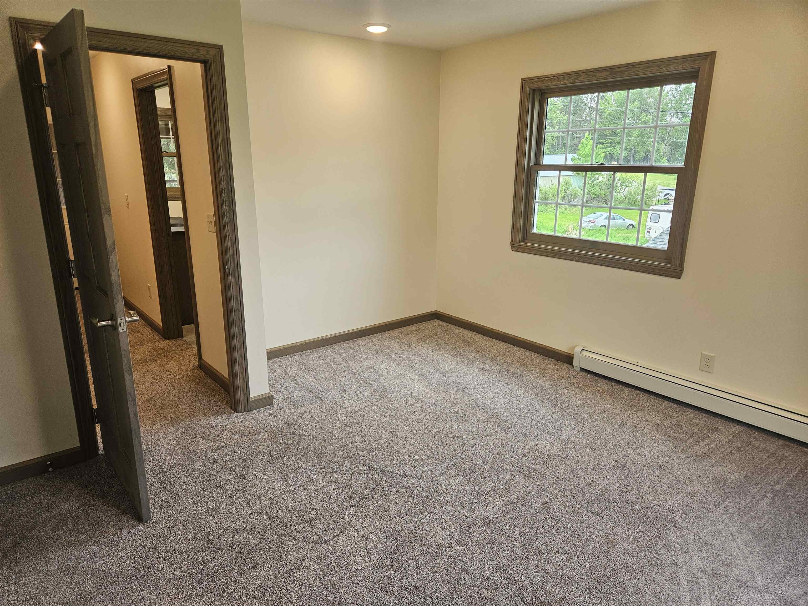 84 Erickson Road Esko, MN 55733 - Photo 8 of 16 Empty room with light carpet and recessed lighting