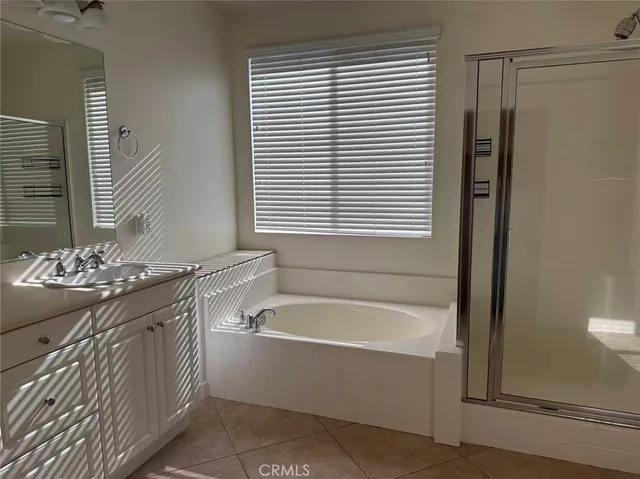 a bathroom with a bathtub and a sink