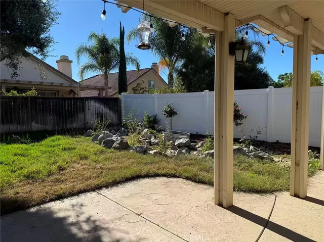 a view of a back yard of the house