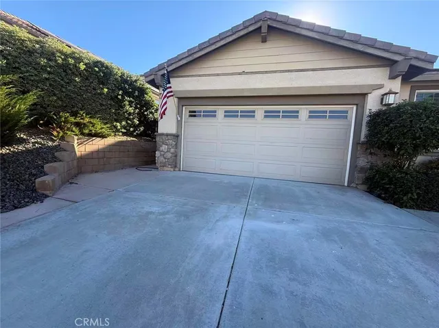 a front view of a house with garage
