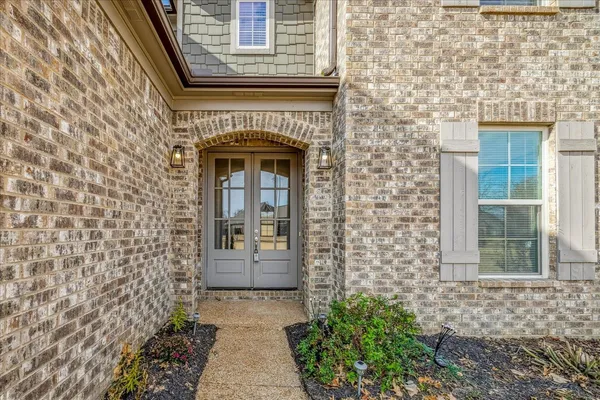 a view of entryway with wooden floor