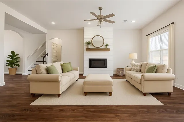 a living room with furniture and a fireplace