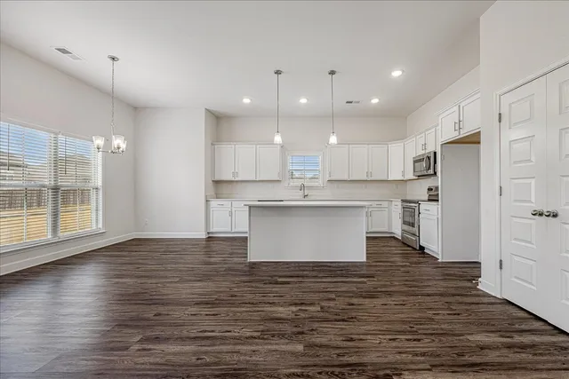 a view of kitchen with wooden floor