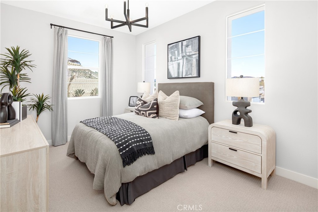 226 Roma Court Walnut, CA 91789 - Photo 13 of 16 a bedroom with a white bed and a chandelier