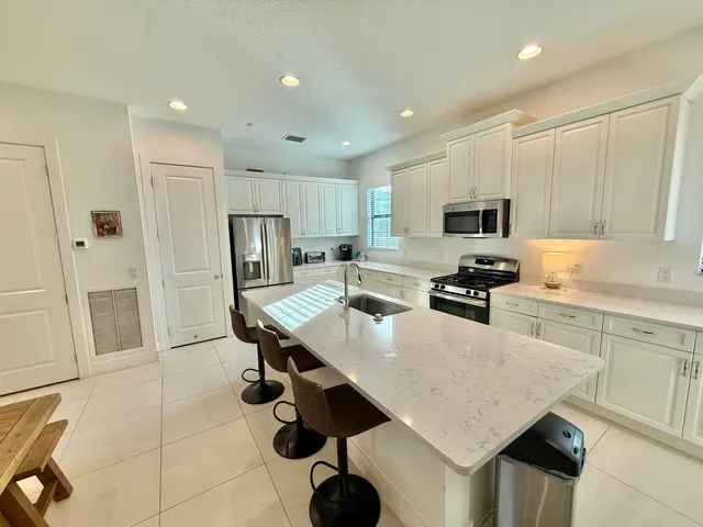a living room with lots of furniture and a table