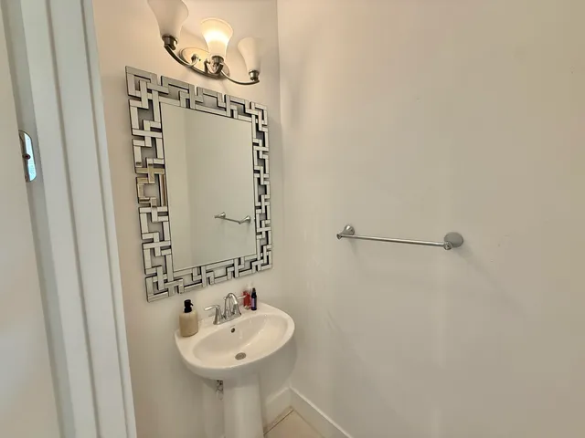 a bedroom with a bed a desk and chair