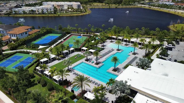 an aerial view of a house with a lake view