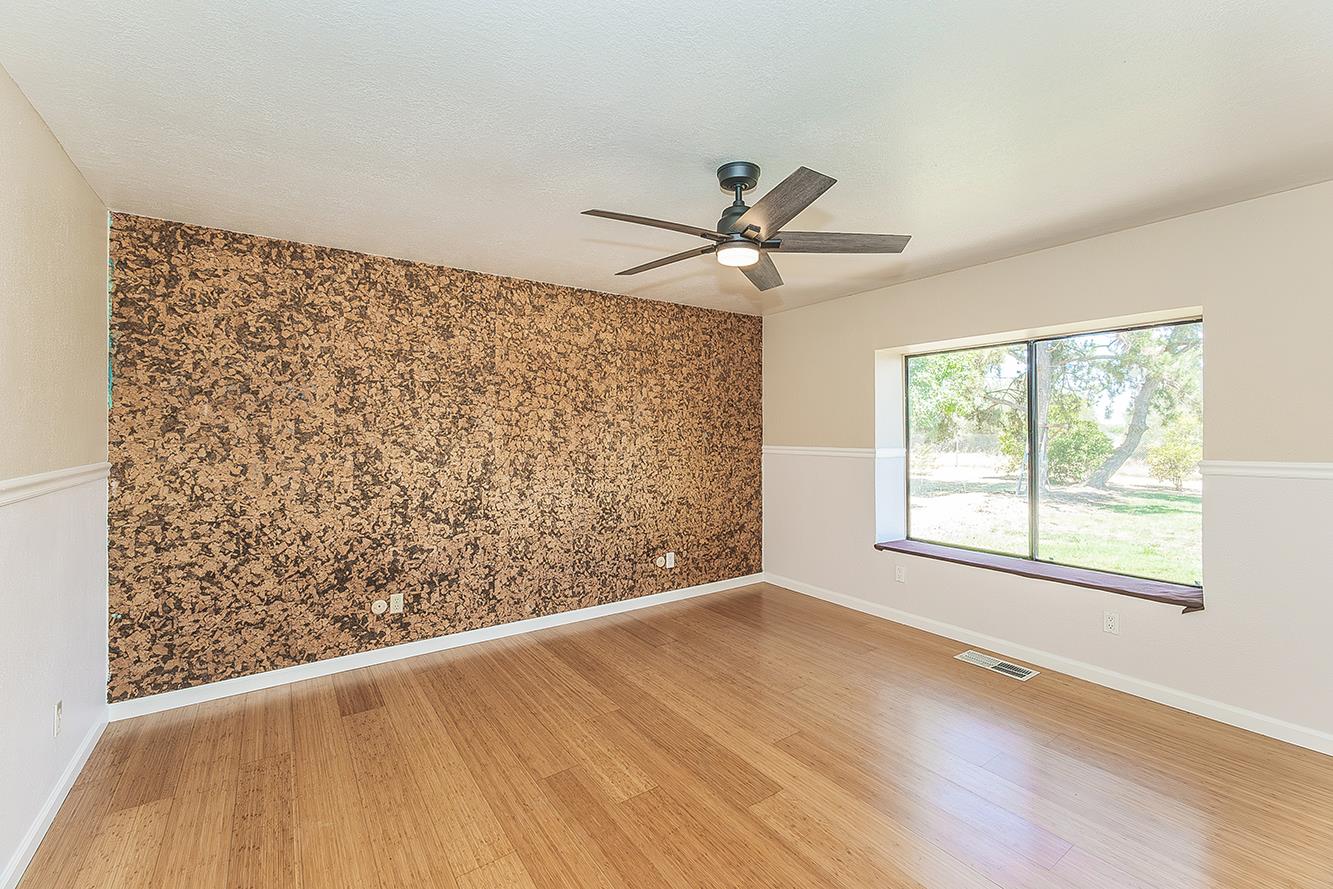 41371 Butte Way Madera, CA 93636 - Photo 28 of 84 a view of a big room with wooden floor and windows