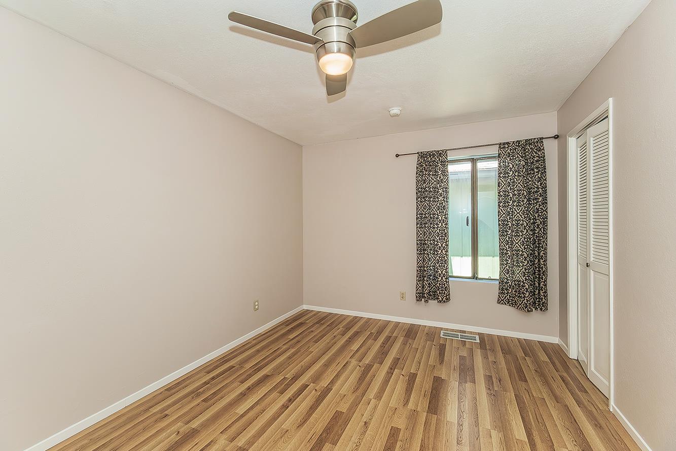 41371 Butte Way Madera, CA 93636 - Photo 34 of 84 wooden floor in an empty room with a window
