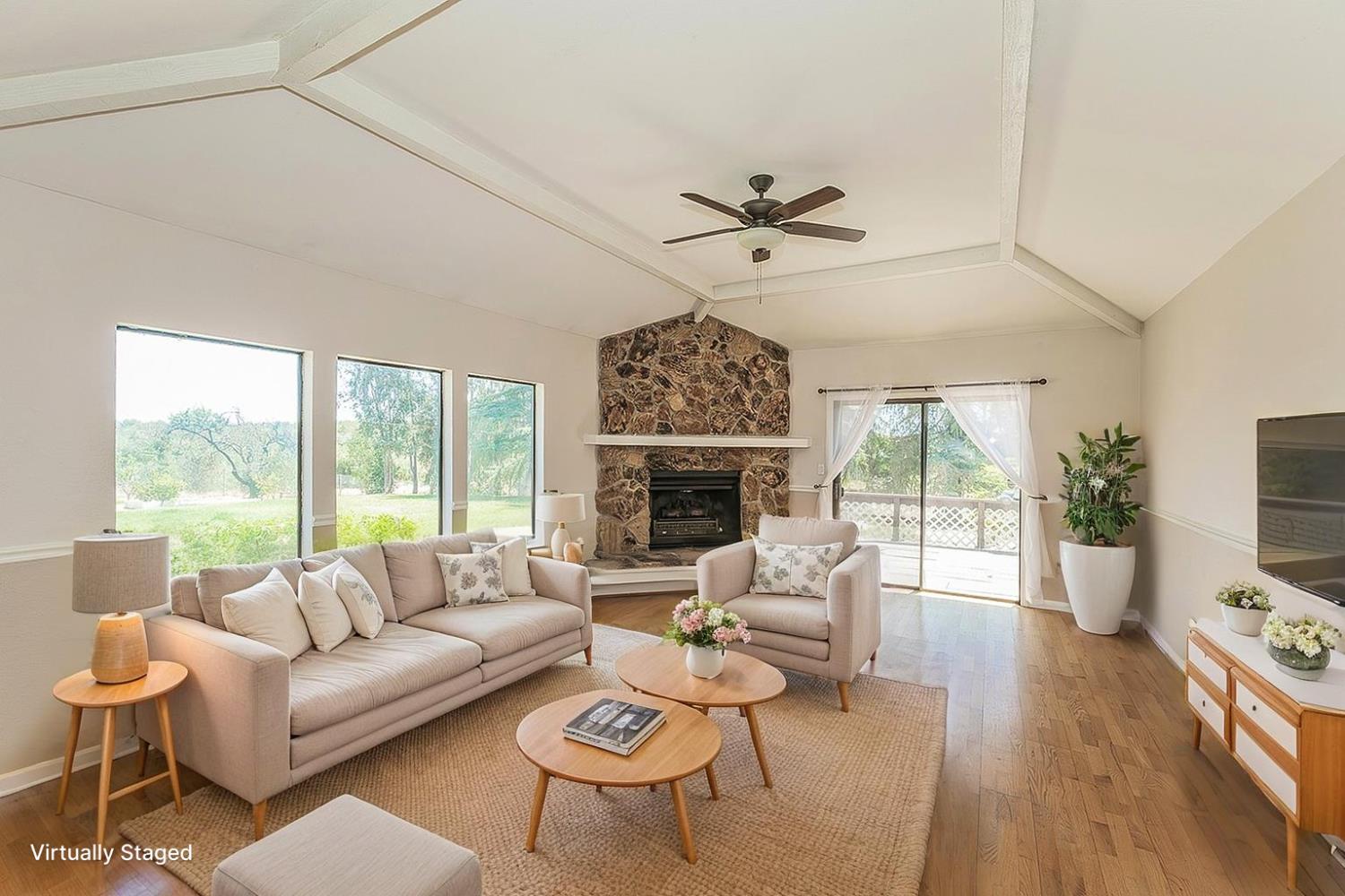 41371 Butte Way Madera, CA 93636 - Photo 6 of 84 a living room with furniture a large window and a flat screen tv