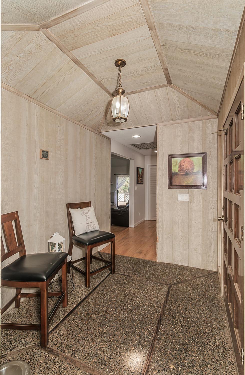 41371 Butte Way Madera, CA 93636 - Photo 10 of 84 a view of a livingroom with furniture and a ceiling fan