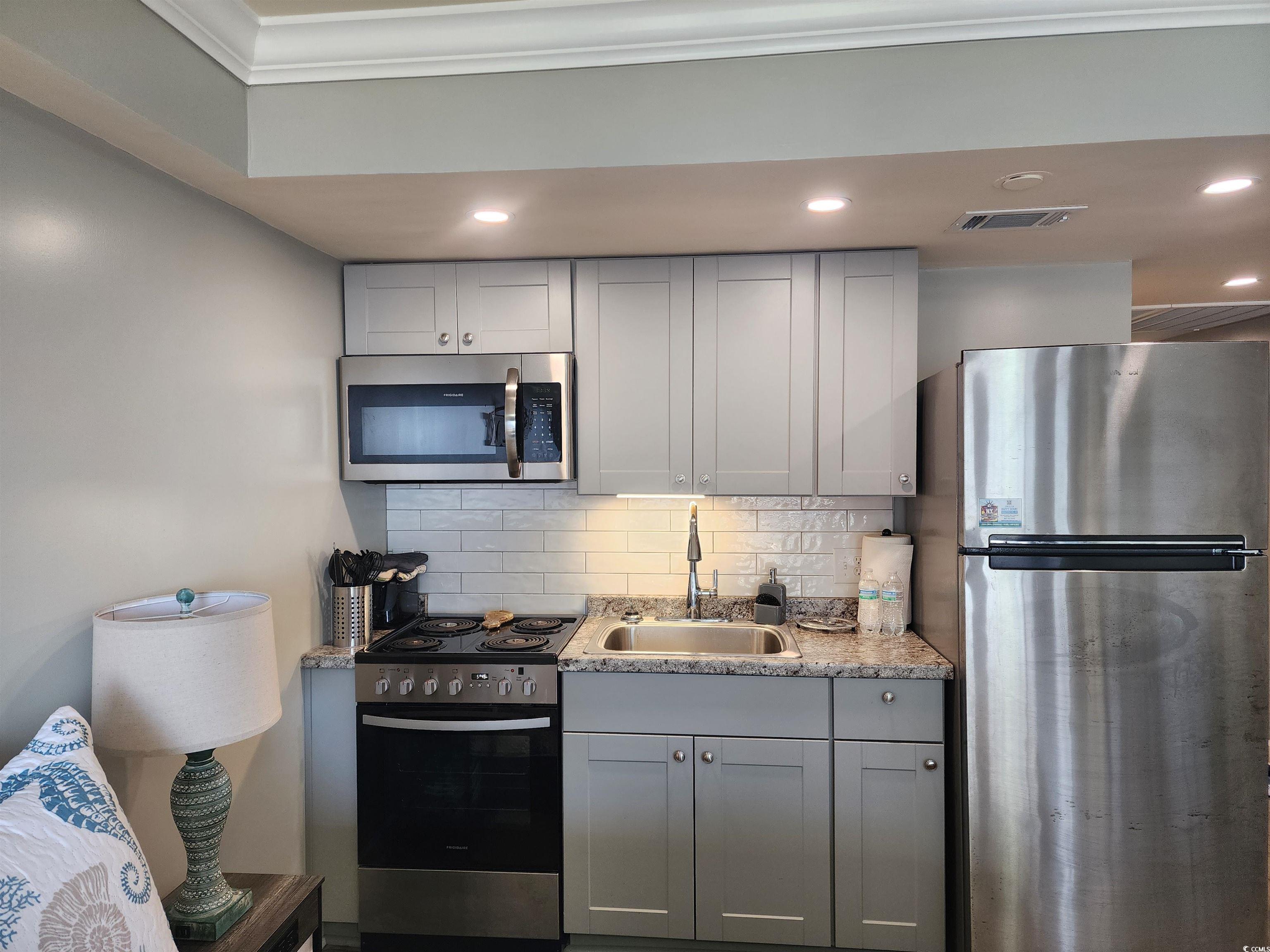 1906 South Ocean Boulevard, Unit 310B Myrtle Beach, SC 29577 - Photo 11 of 34 Kitchen featuring stainless steel appliances, tast