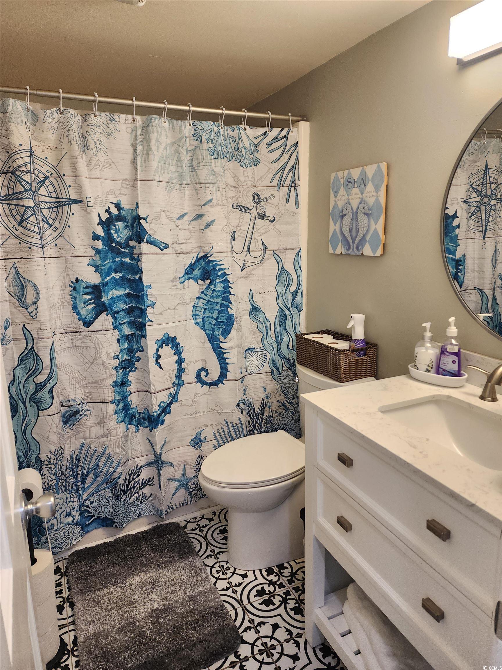 1906 South Ocean Boulevard, Unit 310B Myrtle Beach, SC 29577 - Photo 13 of 34 Full bathroom featuring vanity and tile patterned