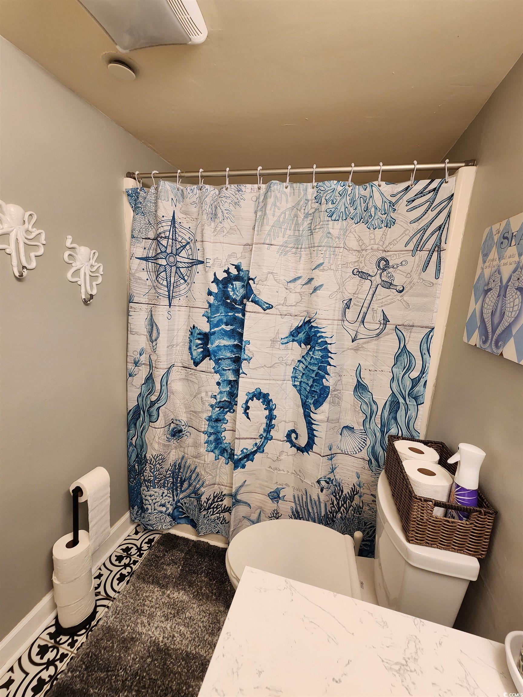 1906 South Ocean Boulevard, Unit 310B Myrtle Beach, SC 29577 - Photo 15 of 34 Full bath featuring toilet and curtained shower