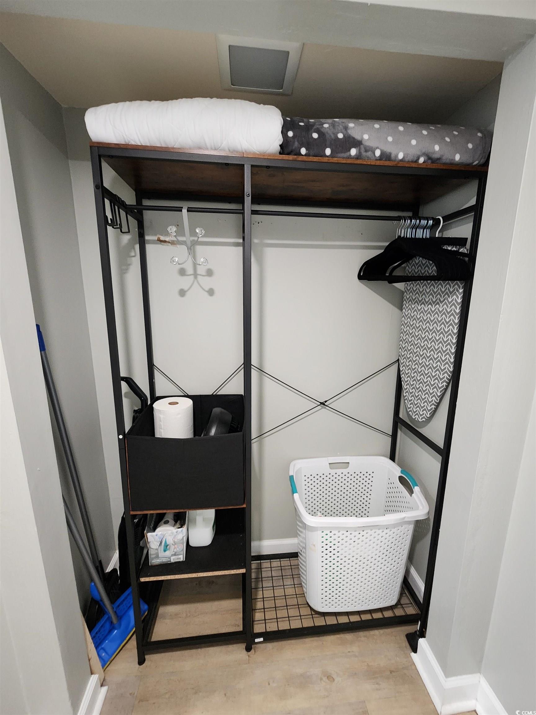 1906 South Ocean Boulevard, Unit 310B Myrtle Beach, SC 29577 - Photo 18 of 34 Walk in closet with light wood finished floors