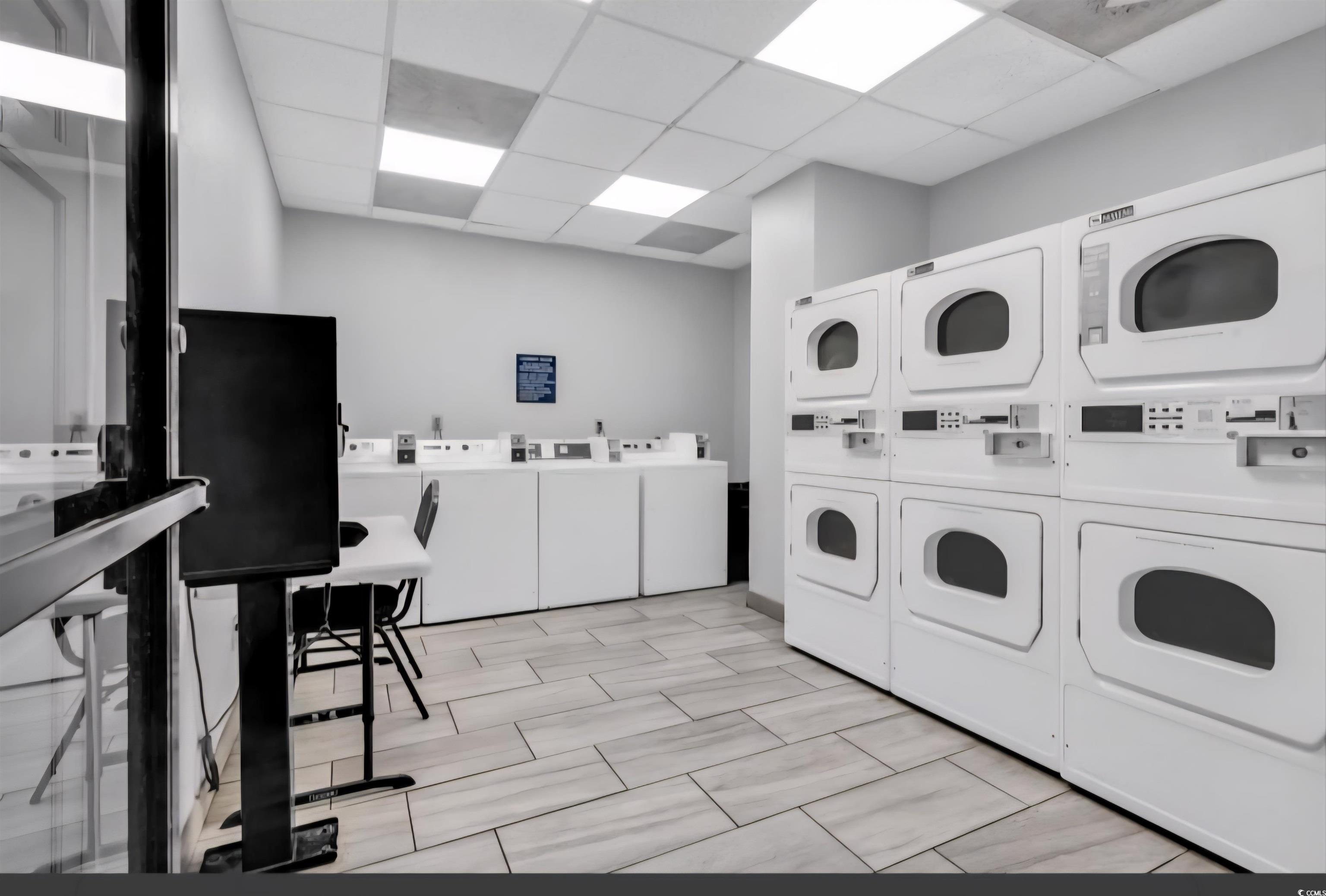 1906 South Ocean Boulevard, Unit 310B Myrtle Beach, SC 29577 - Photo 19 of 34 Community laundry room featuring washing machine a