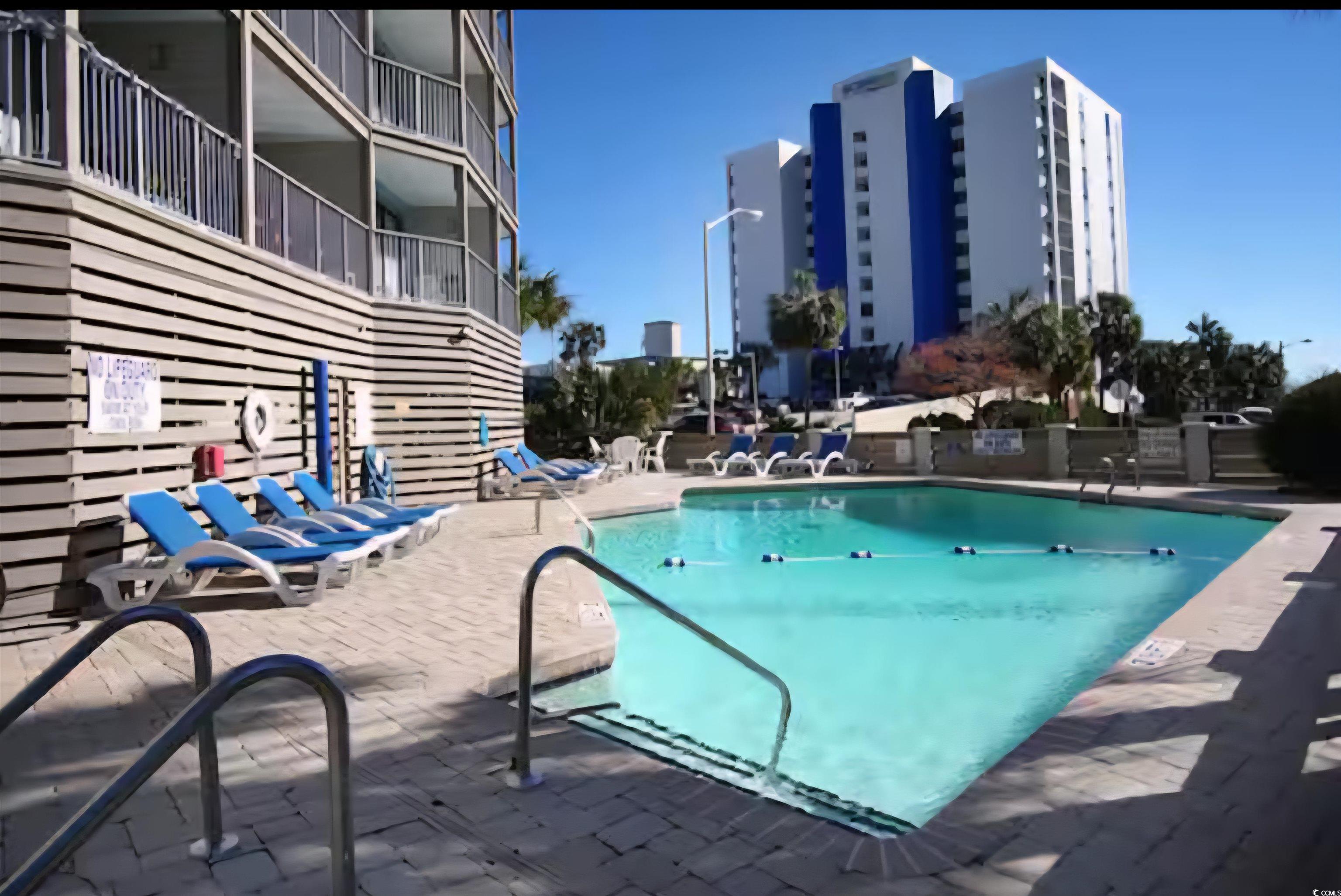 1906 South Ocean Boulevard, Unit 310B Myrtle Beach, SC 29577 - Photo 26 of 34 Community pool with a patio area