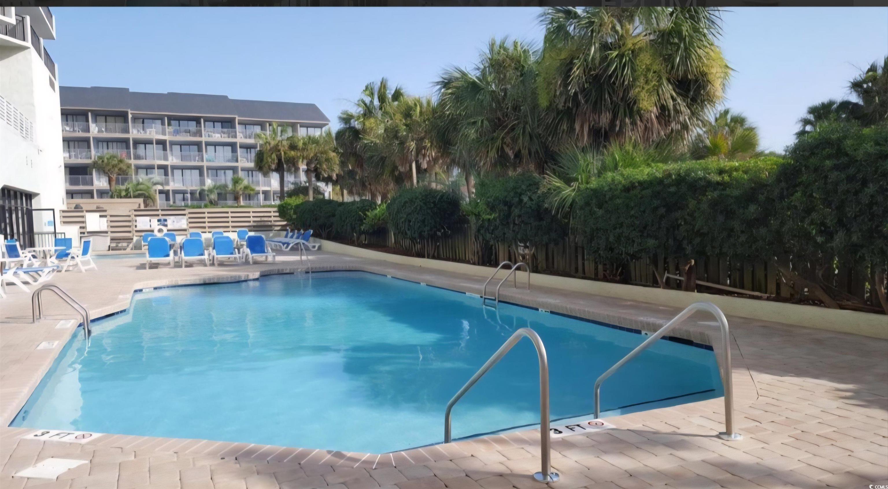 1906 South Ocean Boulevard, Unit 310B Myrtle Beach, SC 29577 - Photo 29 of 34 Community pool featuring a patio area
