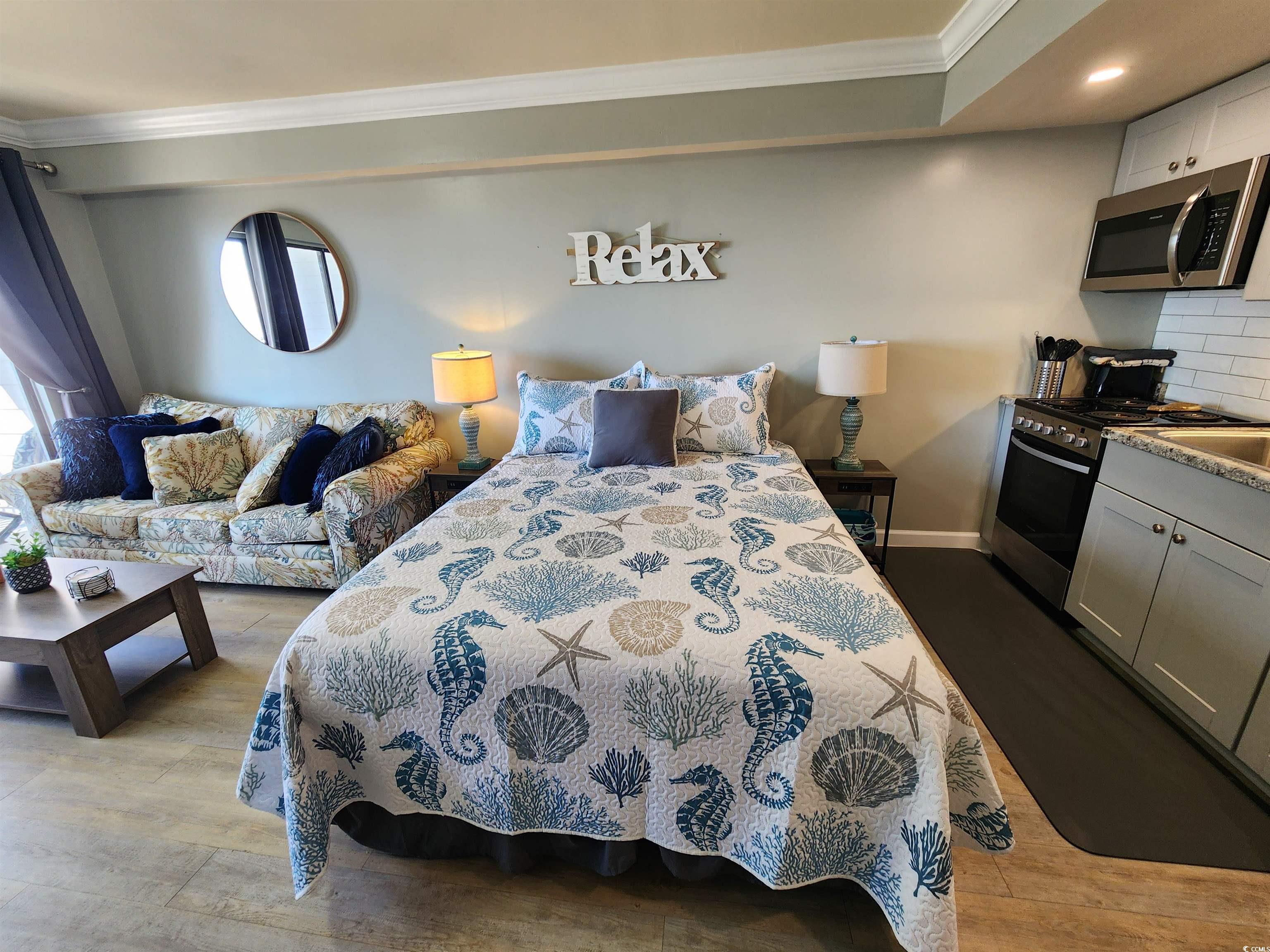 1906 South Ocean Boulevard, Unit 310B Myrtle Beach, SC 29577 - Photo 3 of 34 Bedroom featuring ornamental molding, dark wood-ty