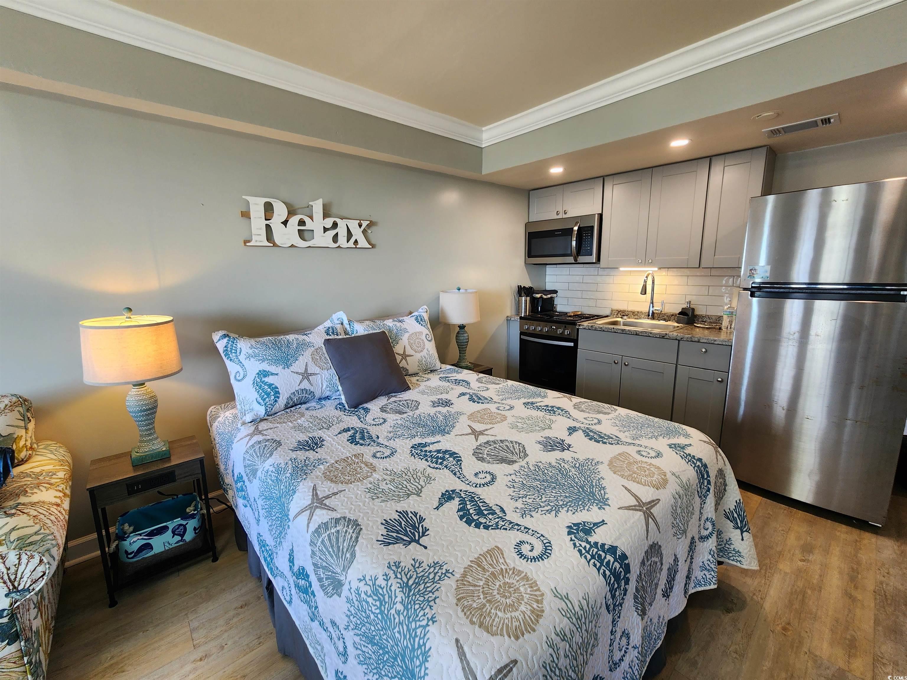 1906 South Ocean Boulevard, Unit 310B Myrtle Beach, SC 29577 - Photo 6 of 34 Bedroom featuring ornamental molding, freestanding