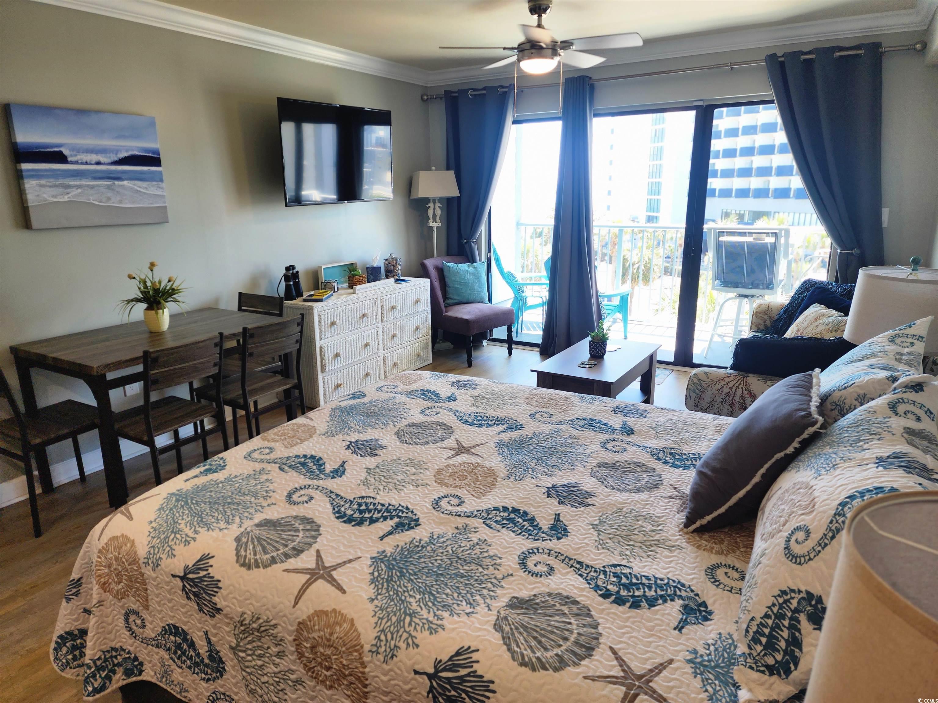 1906 South Ocean Boulevard, Unit 310B Myrtle Beach, SC 29577 - Photo 9 of 34 Bedroom featuring crown molding, wood finished flo