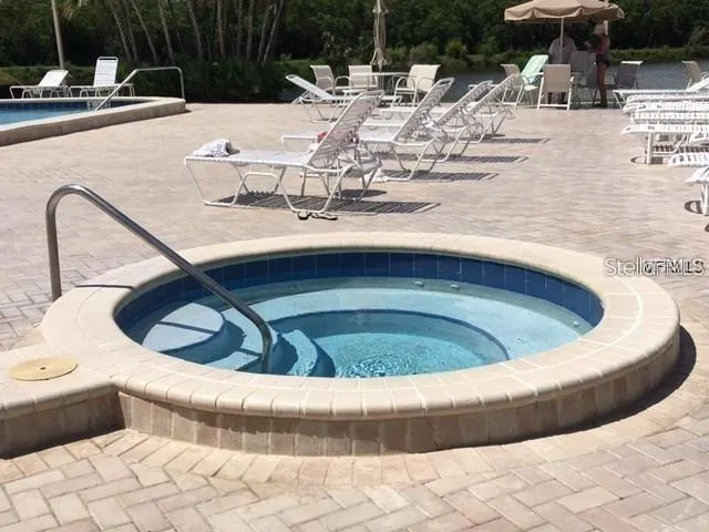 a view of swimming pool with a seating space