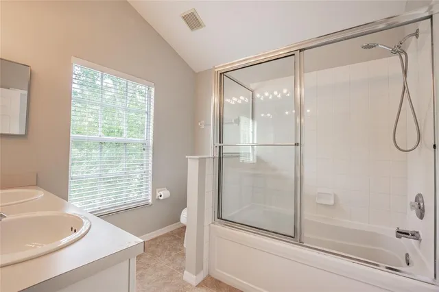 a bathroom with a sink and a shower