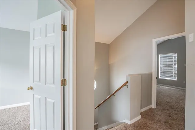 a view of a hallway with staircase