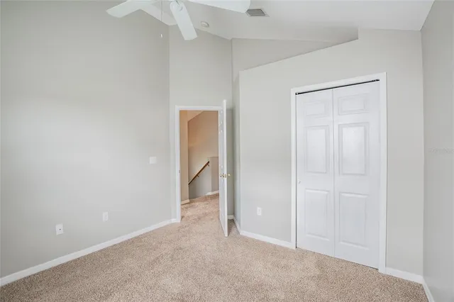 an empty room with closet area