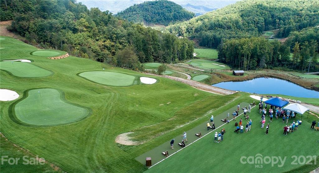 3326 Preserve Road, Unit 98 Sylva, NC 28779 - Photo 8 of 10 a view of a golf course with a swimming pool