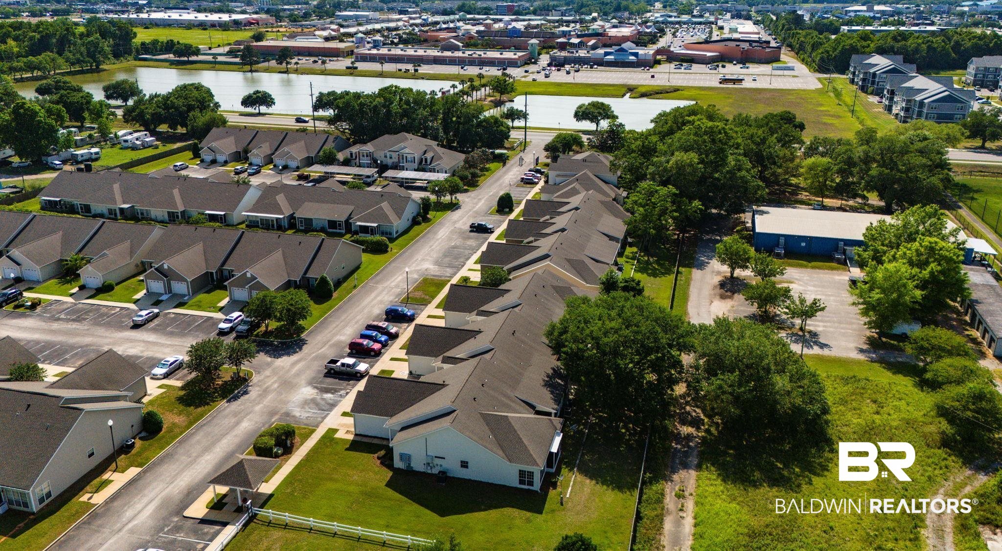 2651 South Juniper Street, Unit 705 Foley, AL 36535 - Photo 33 of 37 Aerial perspective of a residential community featuring multiple single-story units