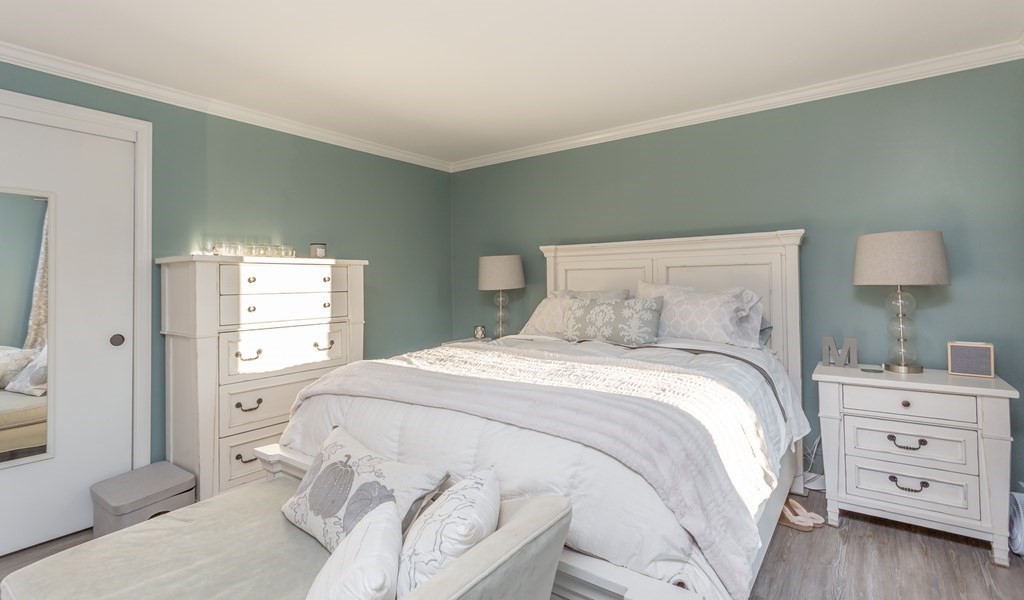 9 Village Way, Unit F Norton, MA 02766 - Photo 11 of 20 a bedroom with a bed and a window