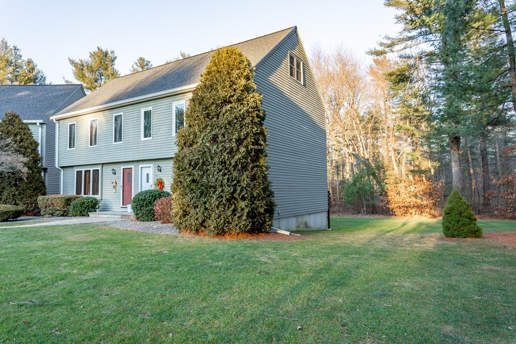 9 Village Way, Unit F Norton, MA 02766 - Photo 17 of 20 a view of a house with a yard