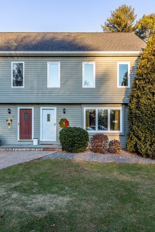 9 Village Way, Unit F Norton, MA 02766 - Photo 18 of 20 a front view of a house with a yard