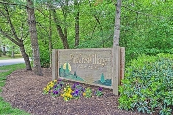 9 Village Way, Unit F Norton, MA 02766 - Photo 2 of 20 a sign on the side of the road