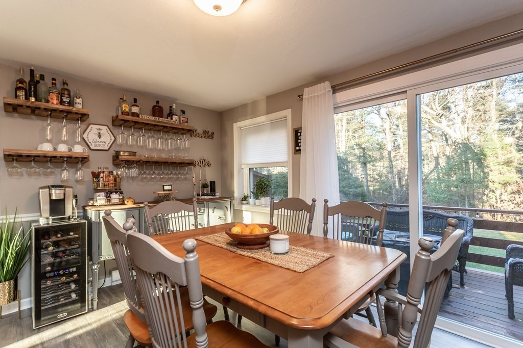9 Village Way, Unit F Norton, MA 02766 - Photo 8 of 20 a view of a dining room with furniture window and outside view