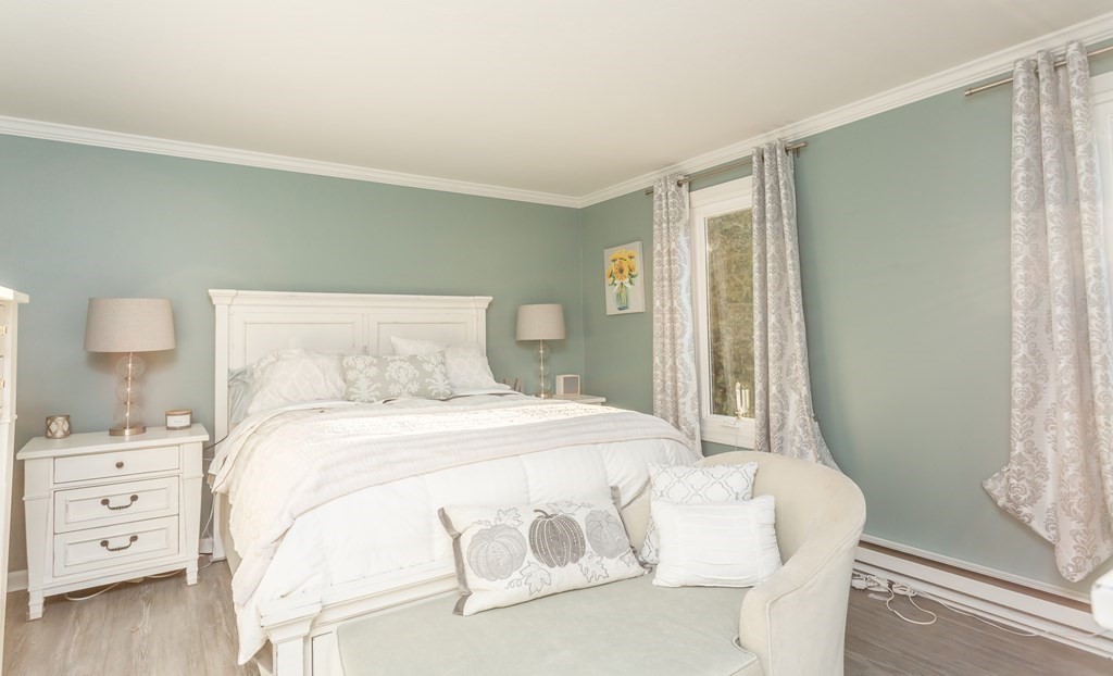 9 Village Way, Unit F Norton, MA 02766 - Photo 10 of 20 a bedroom with a bed and a window