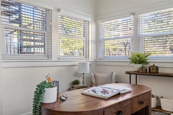 a workspace with furniture and window