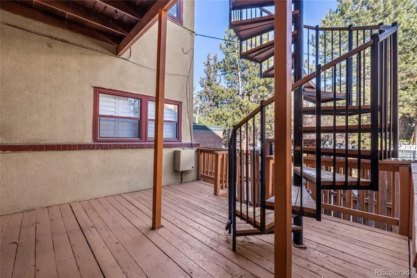 an aerial view of a house with roof deck