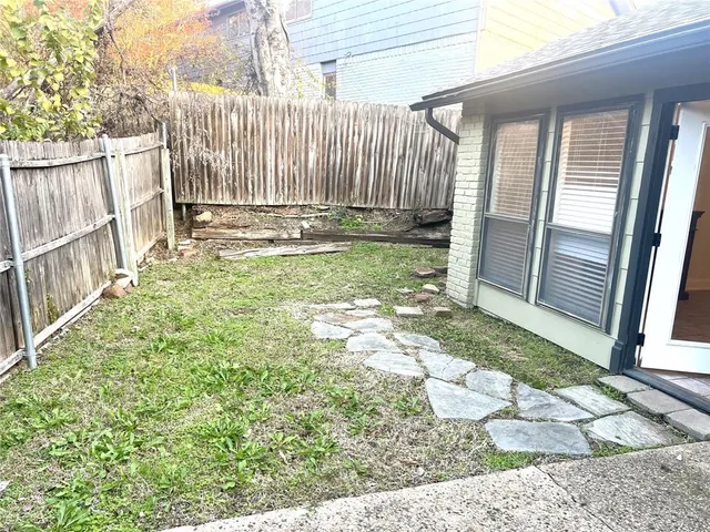 a view of a back yard of the house