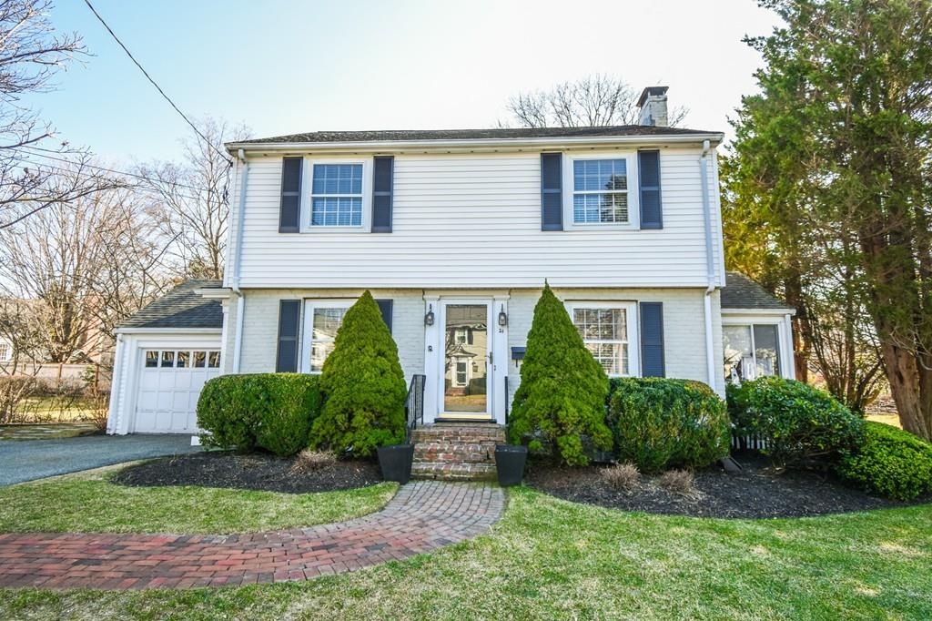 21 Lancaster Road Needham, MA 02492 - Photo 1 of 35 a front view of a house with garden