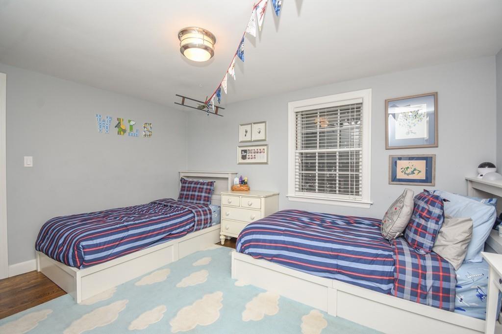 21 Lancaster Road Needham, MA 02492 - Photo 23 of 35 a bedroom with furniture and a window