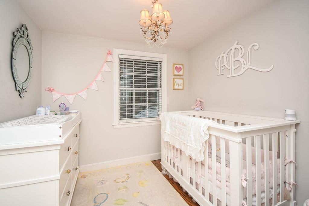 21 Lancaster Road Needham, MA 02492 - Photo 24 of 35 a bedroom with a bed and a window