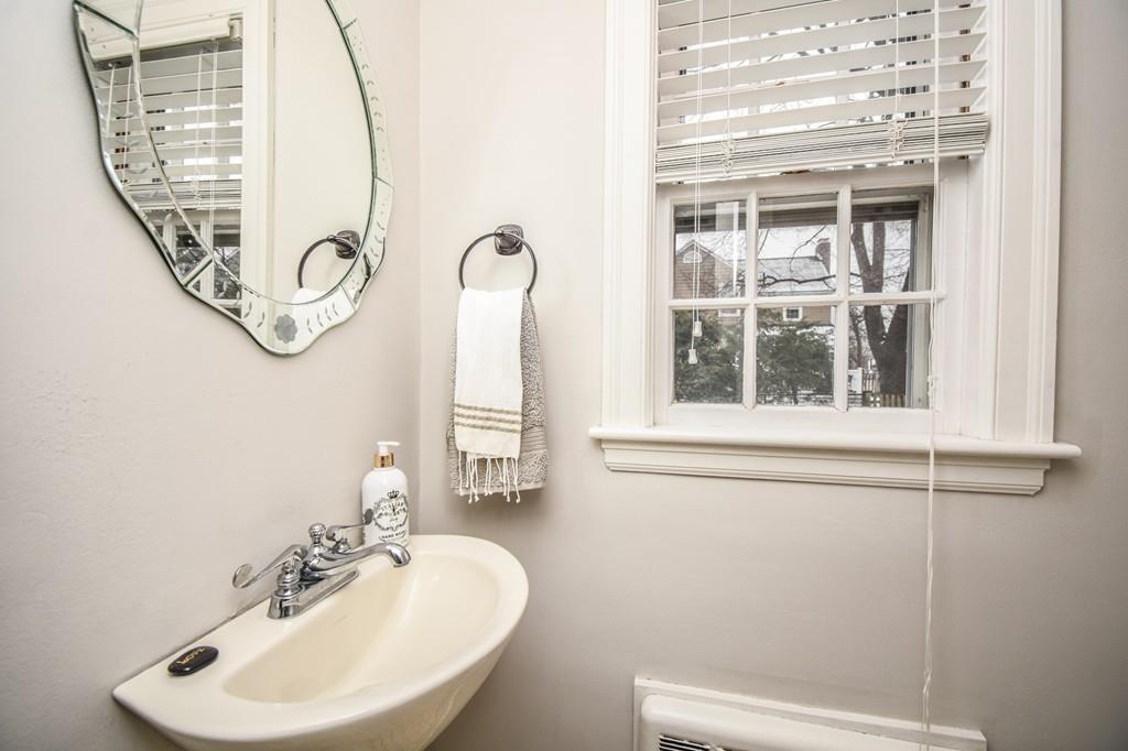 21 Lancaster Road Needham, MA 02492 - Photo 27 of 35 a bathroom with a sink and a mirror