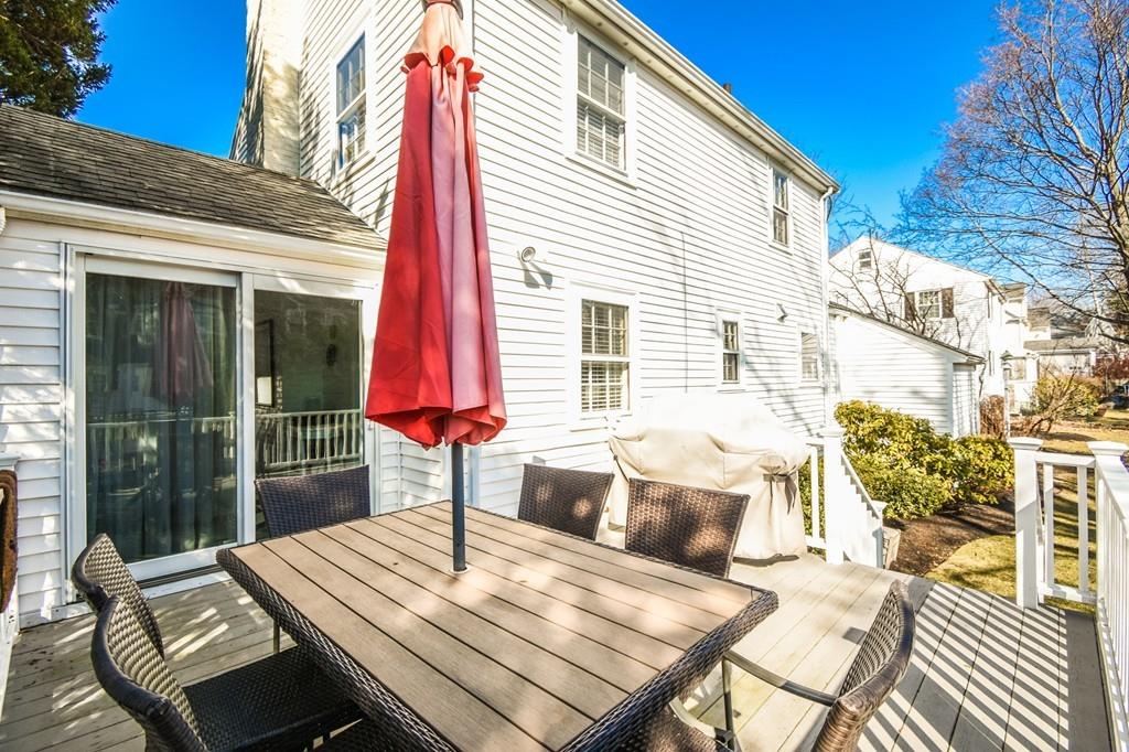 21 Lancaster Road Needham, MA 02492 - Photo 30 of 35 a view of a patio with a table and chairs