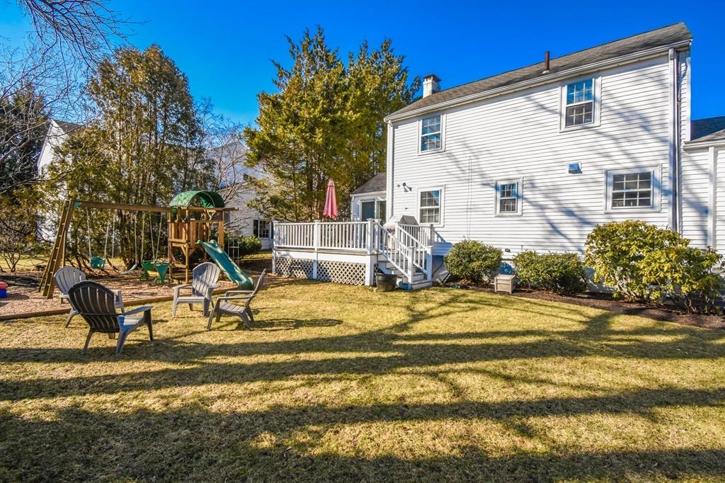 21 Lancaster Road Needham, MA 02492 - Photo 34 of 35 a view of a house with backyard and a tree