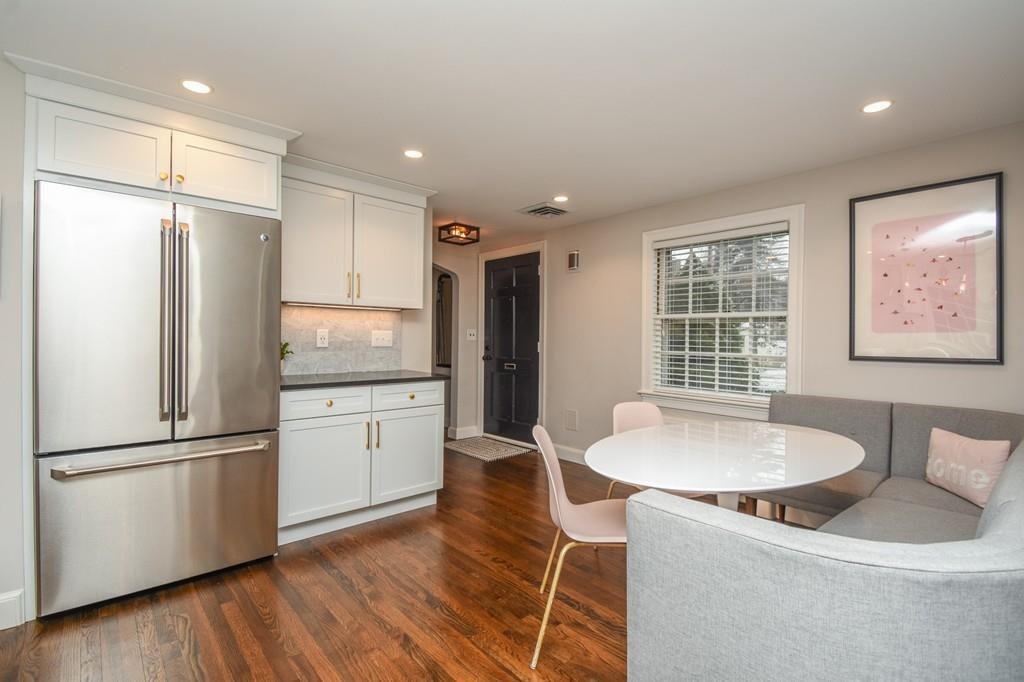 21 Lancaster Road Needham, MA 02492 - Photo 8 of 35 a kitchen with stainless steel appliances granite countertop a refrigerator a sink and a stove